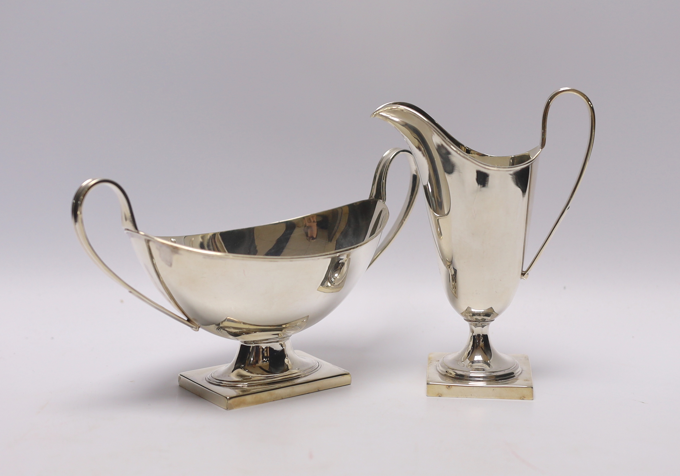 A George VI silver cream jug and two handled sauceboat by Viners Ltd, Sheffield, 1937, jug height 13.7cm, 8.3oz.